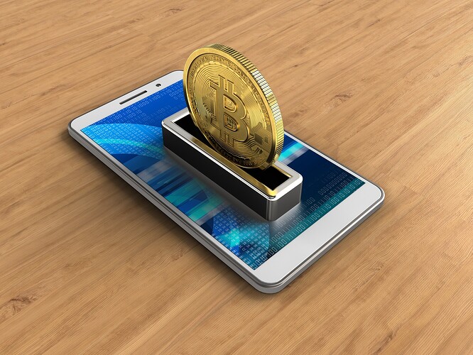 Ein Smartphone als Wallet für einen echten Bitcoin (Symbolbild)