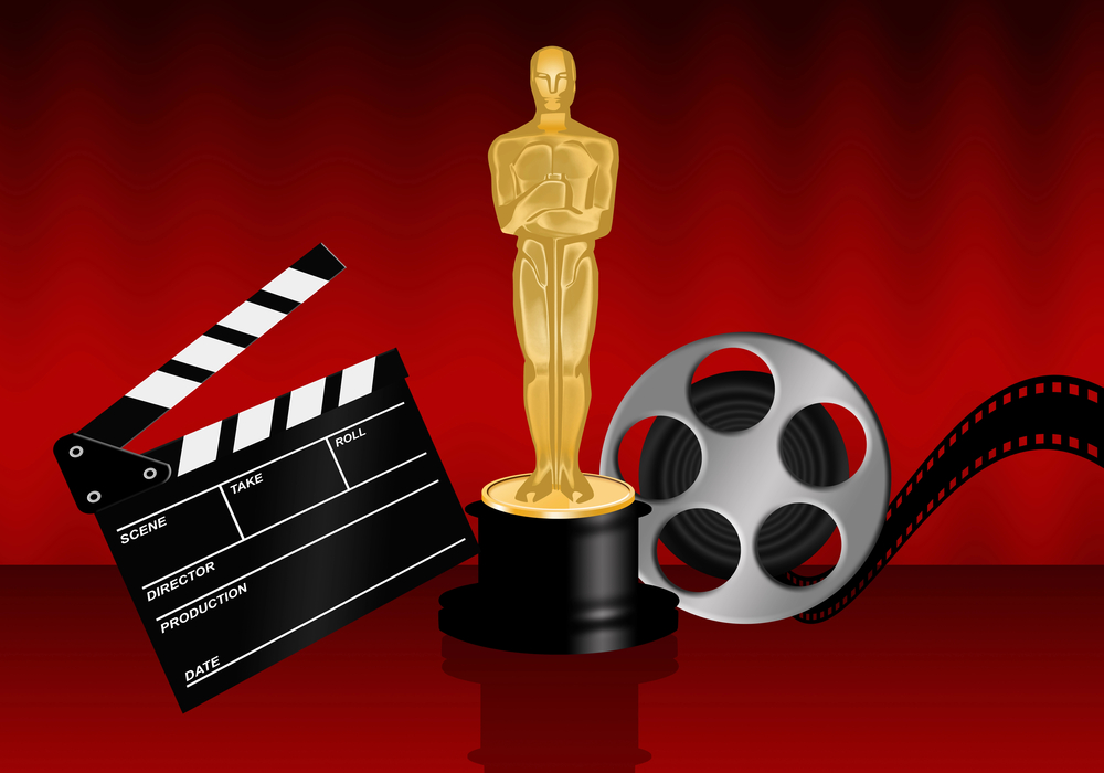 Ein Oscar mit Filmklappe und Rolle