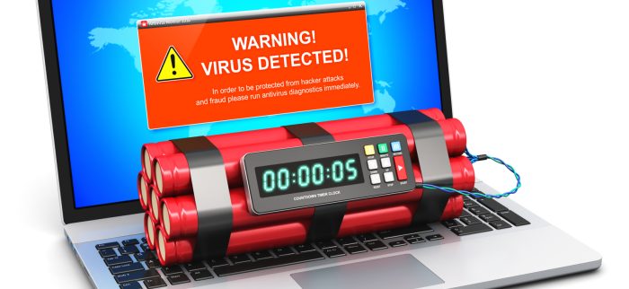 Laptop mit Virenwarnmeldung und Zeitbombe