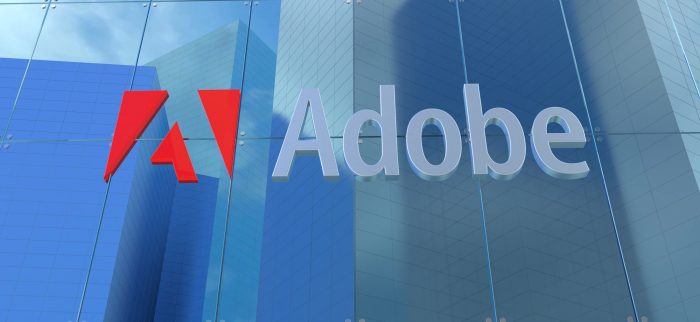 Glasfassade mit Adobe Logo und Schriftzug