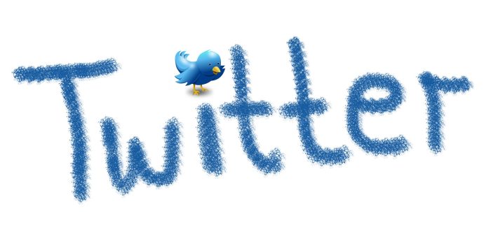 Ein blauer Vogel sitzt auf dem "i" von Twitter